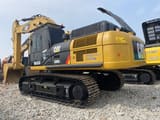2023 Caterpillar 336D2 crawler excavator, rear three-quarter view
