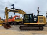 2016 Caterpillar 320E crawler excavator, side profile view