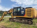 2014 Caterpillar 323E crawler excavator side view