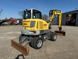 2019 Wacker Neuson EW65 wheel excavator, rear three-quarter view