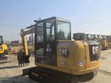 2024 Caterpillar 305.5 mini excavator, rear three-quarter view