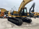2024 Caterpillar 323D crawler excavator, rear three-quarter view
