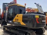 2022 Volvo EC140 crawler excavator, rear three-quarter view