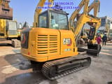 2024 Caterpillar 305.5E2 mini excavator, rear three-quarter view