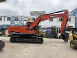 2024 Doosan DX225LCA crawler excavator, side profile view