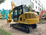 2024 Komatsu PC70-8 mini excavator, rear three-quarter view