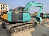 2023 Kobelco SK135SR Grand Beetle crawler excavator, rear three-quarter view