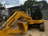 Komatsu PC-55MR mini excavator, front three-quarter view