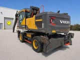 2021 Volvo EW240EMH material handler, rear three-quarter view