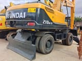 2024 Hyundai 210W-9T wheel excavator rear three-quarter view