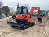 2023 Kubota KX155 mini excavator, front three-quarter view