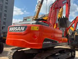 2023 Doosan DX225LCA crawler excavator, rear three-quarter view