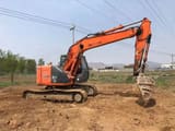 2023 Hitachi ZX135US-6 crawler excavator, side profile view