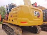 2025 Caterpillar 323 crawler excavator, rear three-quarter view