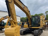 2022 Caterpillar 320GC crawler excavator, front three-quarter view