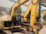 2019 Caterpillar 310 crawler excavator side view