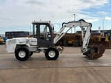 2013 Mecalac 12MXT wheel excavator, side view
