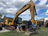 2022 Caterpillar 320GC crawler excavator, side view