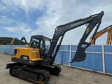 2023 Volvo EC55D mini excavator, rear three-quarter view