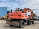 2003 Fiat-Kobelco EX135W wheel excavator, rear three-quarter view