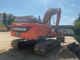 2019 Doosan DX225LC-5 crawler excavator, rear three-quarter view
