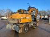 2008 Liebherr A316 material handler, rear three-quarter view
