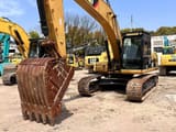 Caterpillar 323D crawler excavator, front three-quarter view