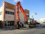 2017 Hitachi ZX360W-3 wheel excavator, side view with grapple attachment