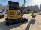 2021 Caterpillar 303.5E mini excavator, rear three-quarter view