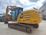 2018 Caterpillar 323 crawler excavator, rear three-quarter view