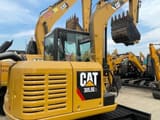 2024 Caterpillar 305.5E2 mini excavator, rear three-quarter view