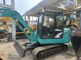 Kobelco SK60 mini excavator, side view