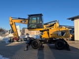 2013 Caterpillar M318D wheel excavator side view