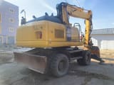 2012 Komatsu PW180-E0 wheel excavator, rear three-quarter view