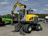 2016 Wacker Neuson EW100 wheel excavator, front three-quarter view