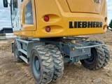 2023 Liebherr A914 Litronic wheel excavator rear three-quarter view