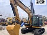2023 Caterpillar 313D crawler excavator, front three-quarter view