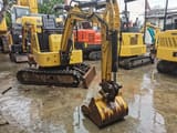 2012 Komatsu PC15MR mini excavator, front three-quarter view