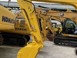 2023 Komatsu PC56-7 mini excavator, side view of boom and bucket