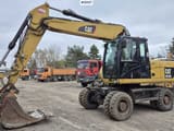 2010 Caterpillar M318D wheel excavator, side view