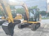 2025 Caterpillar 307 mini excavator, front three-quarter view