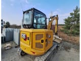 2022 Caterpillar 304 crawler excavator rear three-quarter view