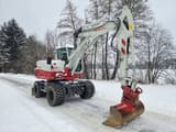2019 Takeuchi TB295W wheel excavator, front three-quarter view
