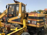 1999 Caterpillar M312 wheel excavator side view