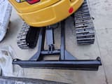 2023 Caterpillar 303.5E mini excavator rear view with blade