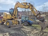 2013 Komatsu PW118 MR-8 wheel excavator, side profile view