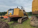2014 Caterpillar 323E crawler excavator, rear three-quarter view