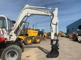 1997 Takeuchi TB070W wheel excavator side view