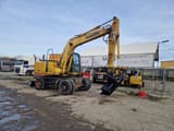 1998 Komatsu PW130ES-6K wheel excavator, side view