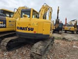 2023 Komatsu PC138US crawler excavator, rear three-quarter view